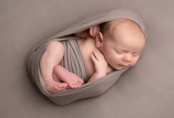 Newborn photography session using neutral colours