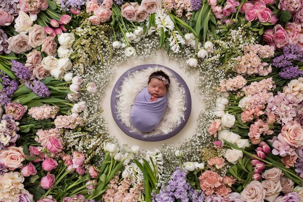 Newborn photography session using fresh flower digital backdrop